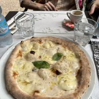 Quattro formaggi pizza and an espressoo  at La Taverna di Pulcinella in Pisa