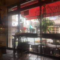 Chairs overlooking an organic store across the street at The Market in Okayama