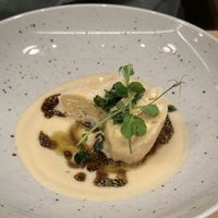 Cottage cheese dumplings, celeriac, aged chickpea miso, pumpkin seeds, parsley  at Bistro Maha in Ljubljana