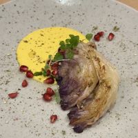Roasted cabbage, turmeric soy yoghurt, aromatised olive oil, za’atar  at Bistro Maha in Ljubljana