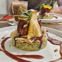 Chef's seasonal special. A traditional Slovenian dish with fermented turnip, unleavened bread, gravy, vegetable chips, and juicy marbles stake. at Bistro Maha in Ljubljana