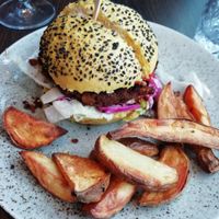 Chickpea burger with mixed fries at Bistro Maha in Ljubljana