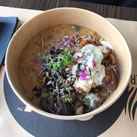 Warm bowl with tempeh, vegetables and a stew at Bistro Maha in Ljubljana