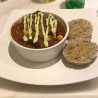 Bean chilli with house nut bread  at Vinnie's Eatery in Cheltenham