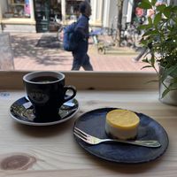 Coffee and cheesecake with cashews cream, ginger, mango and base made with dates and nuts  at More Pastry in Delft