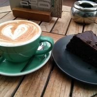 Lovely vegan chocolate cake and a dirty chai latte with oat milk   at Anne&Max in Arnhem
