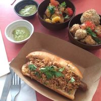 Hot dog and sides (plantains, cauliflower wings) at Jah Jah in Paris