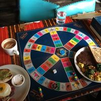 Trivial pursuit. Huevos breakfast slam and cortado on left, vegan tofu scramble breakfast plate on right. at Sweetness 7 Cafe in Buffalo