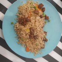 Brown rice with protein chunks and satay sauce at El Enano Verde in Torremolinos