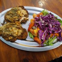 Milanesa con queso y champ at La Reverde Parrillita Vegana in Buenos Aires