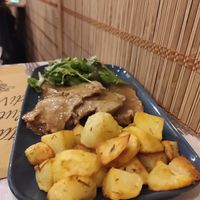 Roasted homemade seitan with chianti and rosemary potatoes at Nirvana in Florence