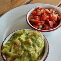 Chips come with guacamole, tomatoes, a small bowl of beans and 2 different hot sauces. at Wacamole in Punta Cana