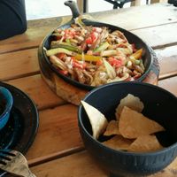 If you order the fajitas, you get 5 corn tortillas and the vegetables (onions, bell pepper, zucchini, eggplant) come on a sizzling skillet.  at Wacamole in Punta Cana
