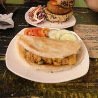 vegan burger in the back and samossa. Both were too dry. With a sauce it would be better. at Indah Cafe in Kuching