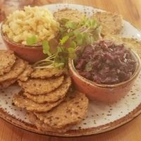 Almond Chevre cheese with olive tapande served with crackers at Surya Cafe in Fitchburg