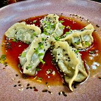 Portobello & Swiss Chard Gyozas ($11) with ginger-tamari sauce, chili-garlic oil, and sesame seeds. at Mahalo in Panama City
