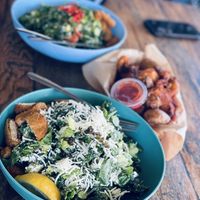 Kale caesar, chopped salad, and crispy potatoes  at Spoke Bicycle Cafe in Los Angeles