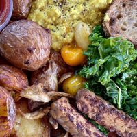 Tofu scramble , potatoes, toast, kale, tomatoes, mushrooms, smoked Tempe!   at Spoke Bicycle Cafe in Los Angeles