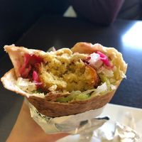 Amazing falafel and hummus wrap. at Delina's in Toronto