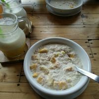 porridge with coconut milk and fruits  at Cafe del Sunshine in Koh Chang