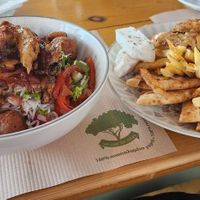 Vegan Mexican bowl & vegan gyros with vegan tzatziki, pita and french fries at Evilion Bistro in Crete