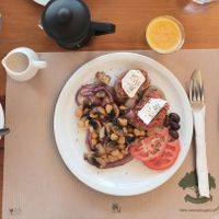 Vegan breakfast (4/5) (strawberry/peach jam and margarine under the bread, they also had almond milk for the coffee) at Evilion Bistro in Crete