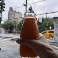 Orange carrot fresh pressed juice   at The Butcher's Daughter - West Village in New York City