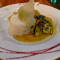 Ecuadorian curry with patacones. at El Jardin in Puerto Ayora
