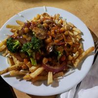 Curry poutine (with a funky pineapple sauce - so good!!) at Taps Brewhouse & Grill in Niagara Falls