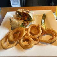 Veggie wrap with vegan onion rings   at Taps Brewhouse & Grill in Niagara Falls