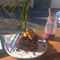 Chocolate waffle stack! And a Berry smoothie. Was amazing! at Nourish'd Cafe & Juicery - Kloof in Cape Town