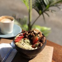 Gone green breakfast bowl and oat milk flat white  at Nourish'd Cafe & Juicery - Kloof in Cape Town