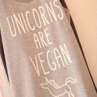 The staff shirts 🦄🤩  at Nourish'd Cafe & Juicery - Kloof in Cape Town