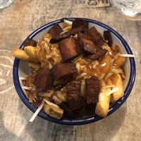 Vegan gravy bacon fries   at Bread Meats Bread in Edinburgh