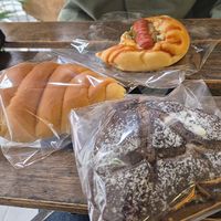 Front to back: chocolate black sesame bread, snail bread with peanut butter, hot dog bread at HiPizza in Taipei