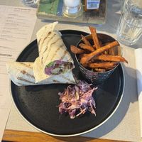 Sweetcorn [fritter] roti roll with a side of sweet potato fries.  at Turtle Bay in Newcastle Upon Tyne