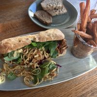 Hot dog with pulled planted and sweet potato fries at Hotel Schweizerhof Lenzerheide in Lenzerheide
