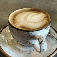 Coffee with soy milk. at Honest Greens - Castellana in Madrid