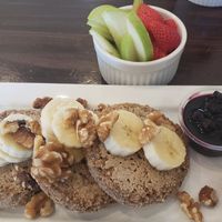 Organic Vegan, gluten free pancakes with blueberry compote and a side of fruit. at The Daily Harvest Cafe & Juicery in Santa Clarita