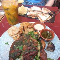 Vegan lentil steak with grilled veggies and fried plantain at Andino Gastrobar in Malaga