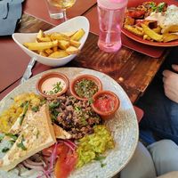 Tofu, fried plantain, rice and beans, guac, tomatoes, onions, dips. Sooo delish! at Andino Gastrobar in Malaga