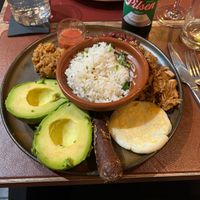 Mixed plate with rice, beans, vegan sausage and other bits at Andino Gastrobar in Malaga