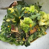 Steel cut oats with herbs and greens —recommended  at abcV in New York City