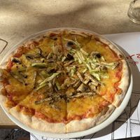 Pizza with vegan cheese at Ombra Restaurant in Kotor