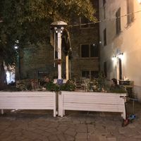 One of several dining areas near the landmark black poplar tree. at Ombra Restaurant in Kotor