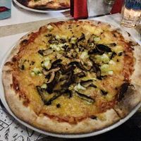 Vegan pizza with vegan cheese. at Ombra Restaurant in Kotor