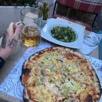 Vegan pizza with potato side and beer!  at Ombra Restaurant in Kotor
