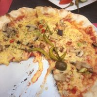 Vegetarian pizza with vegan cheese at Ombra Restaurant in Kotor
