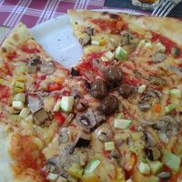 Vegetarian pizza with plant-based 'cheese'  at Ombra Restaurant in Kotor
