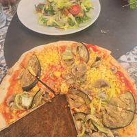 Vegan pizza and half a garden salad at Ombra Restaurant in Kotor